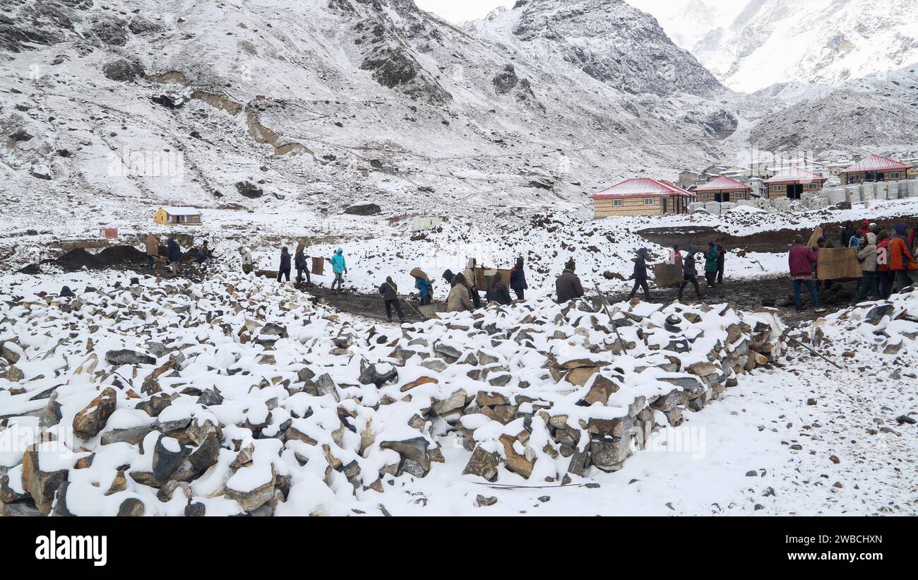 Kedarnath reconstruction after disaster in extreme winter and snowfall. Government made a reconstruction plan for the Kedarnath temple area that was damaged in floods of 2013. Stock Photo