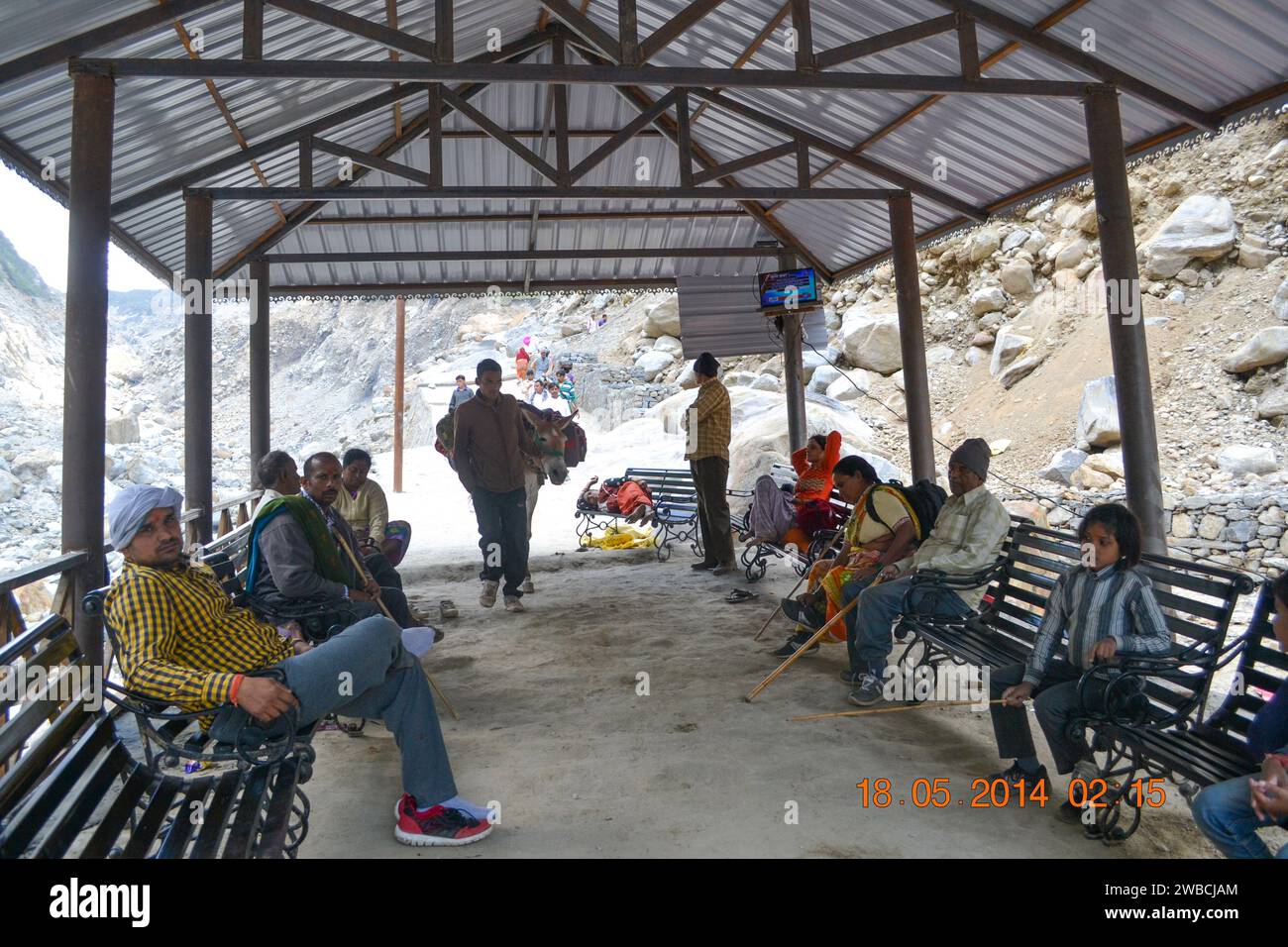 Rudarprayag, Uttarakhand, India, May 18 2014, Pilgrims resting in shed on the way to Kedarnath temple. Government made many shed for pilgrims in Kedarnath reconstruction Project.  Stock Photo