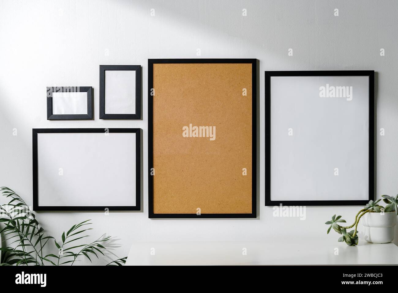 Set of black frames on white wall with copy space Stock Photo
