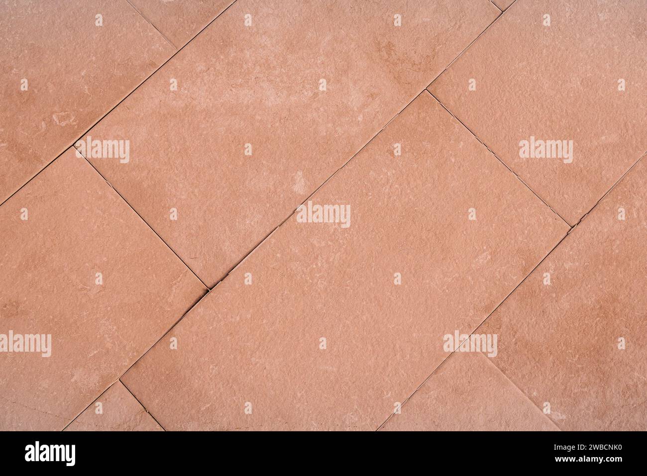 stone tile concrete Peach Fuzz texture in cement background light pink Stock Photo