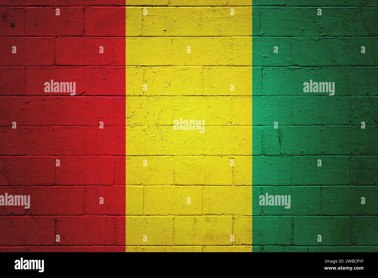 Flag of Guinea painted on a cinder block wall Stock Photo - Alamy