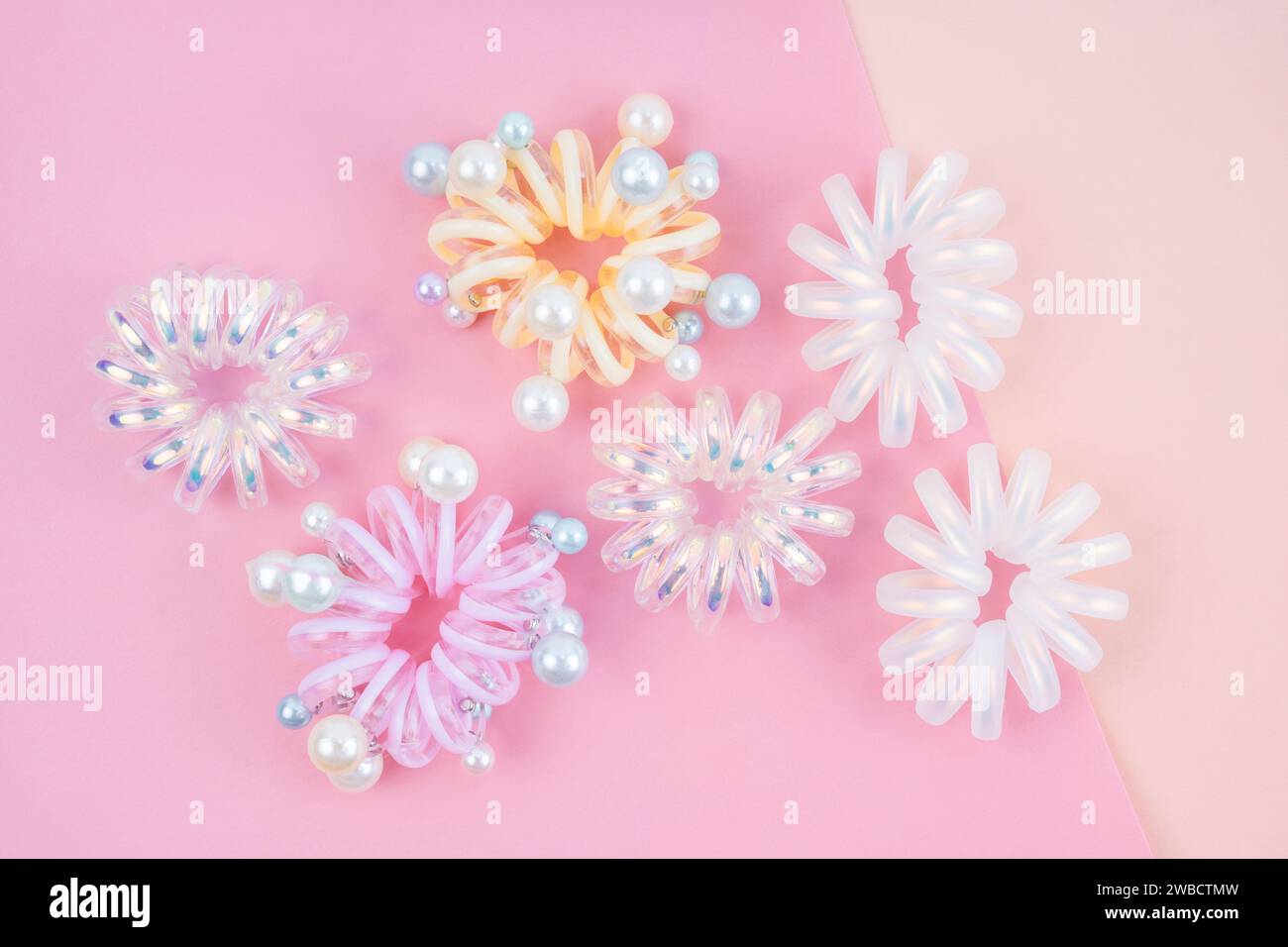 Colorful plastic hair elastics set on beautiful background Stock Photo