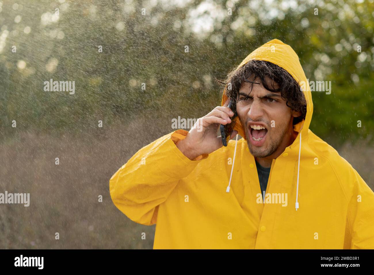 Man in the rain angry hi-res stock photography and images - Alamy