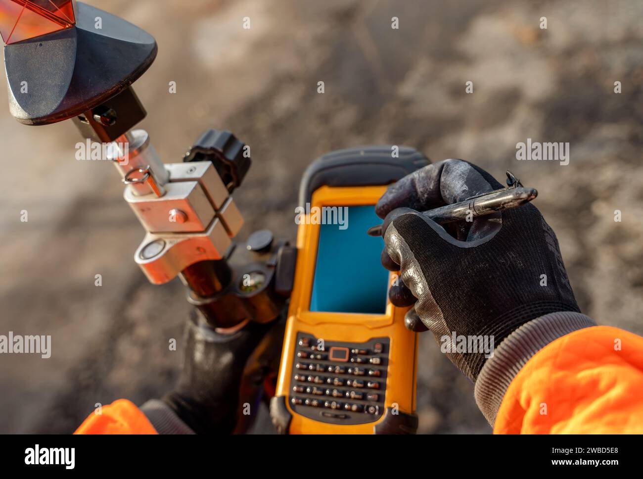 Site Controller Device Site engineer operating his touch screen controller instrument during ...