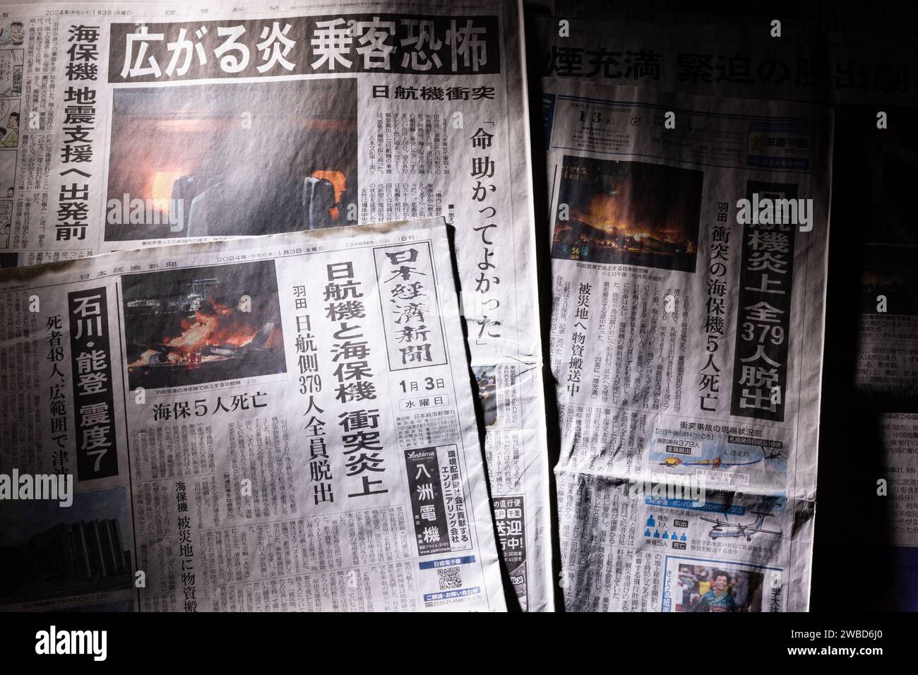 Japanese newspapers on January 3, 2024 reporting the 2024 Haneda Airport runway collision are seen in Tokyo, Japan on January 10, 2024. On January 2, 2024, a runway collision occurred between an Airbus A350, operating Japan Airlines Flight 516 and a De Havilland Canada Dash 8 operated by the Japan Coast Guard at Haneda Airport in Tokyo, Japan. After the collision, both airplane aircraft caught fire. Five of the six crew of the Japan Coast Guard on Dash 8 died, but all 367 passengers and 12 crew on the Airbus A350 survived. Credit: Shingo Tosha/AFLO/Alamy Live News Stock Photo