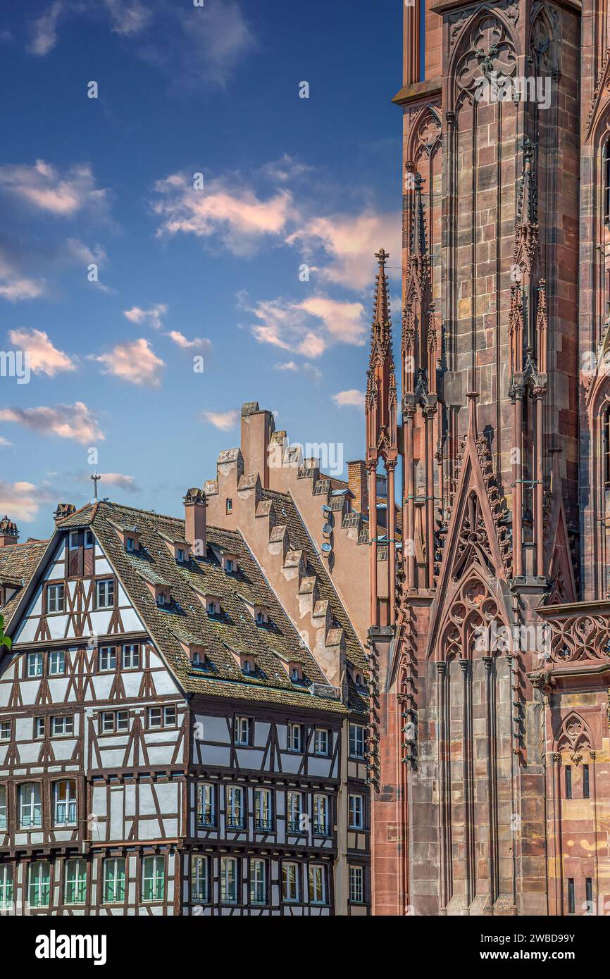 STRASBOURG, FRANCE-MAY 3, 2023: View from Place du Château of the medieval half-timbered old houses and exterior of Notre Dame Cathedral de Strasbourg Stock Photo