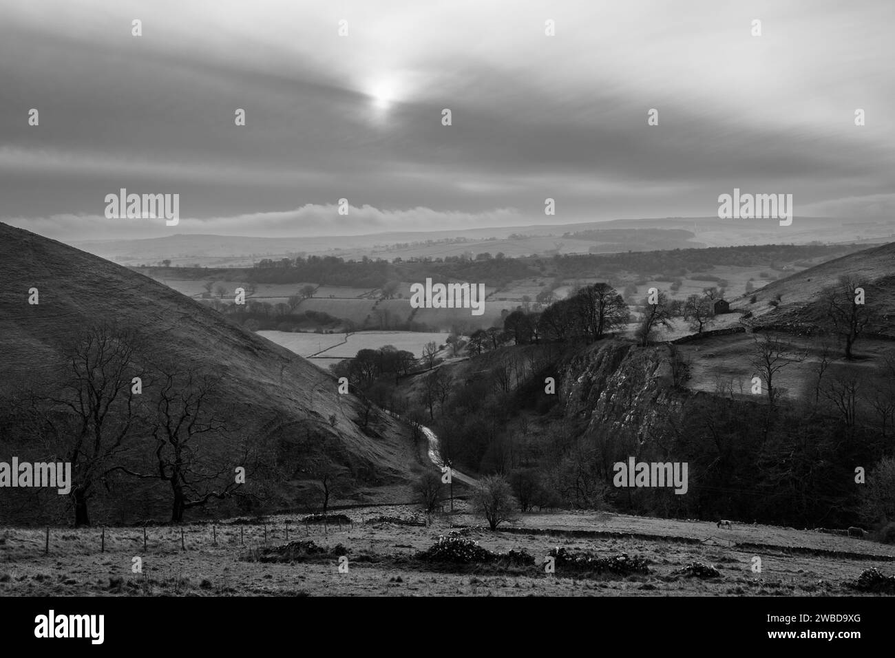 A wintry scene in the Peak District - Aldery Cliff and the Dove Valley near Earl Sterndale, Derbyshire Stock Photo