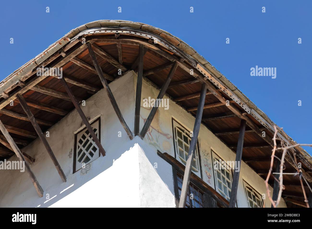 216 Corner of the wall, and roof eaves of an Ottoman-style house, the richest in town, in the old city upper part. Gjirokaster-Albania. Stock Photo