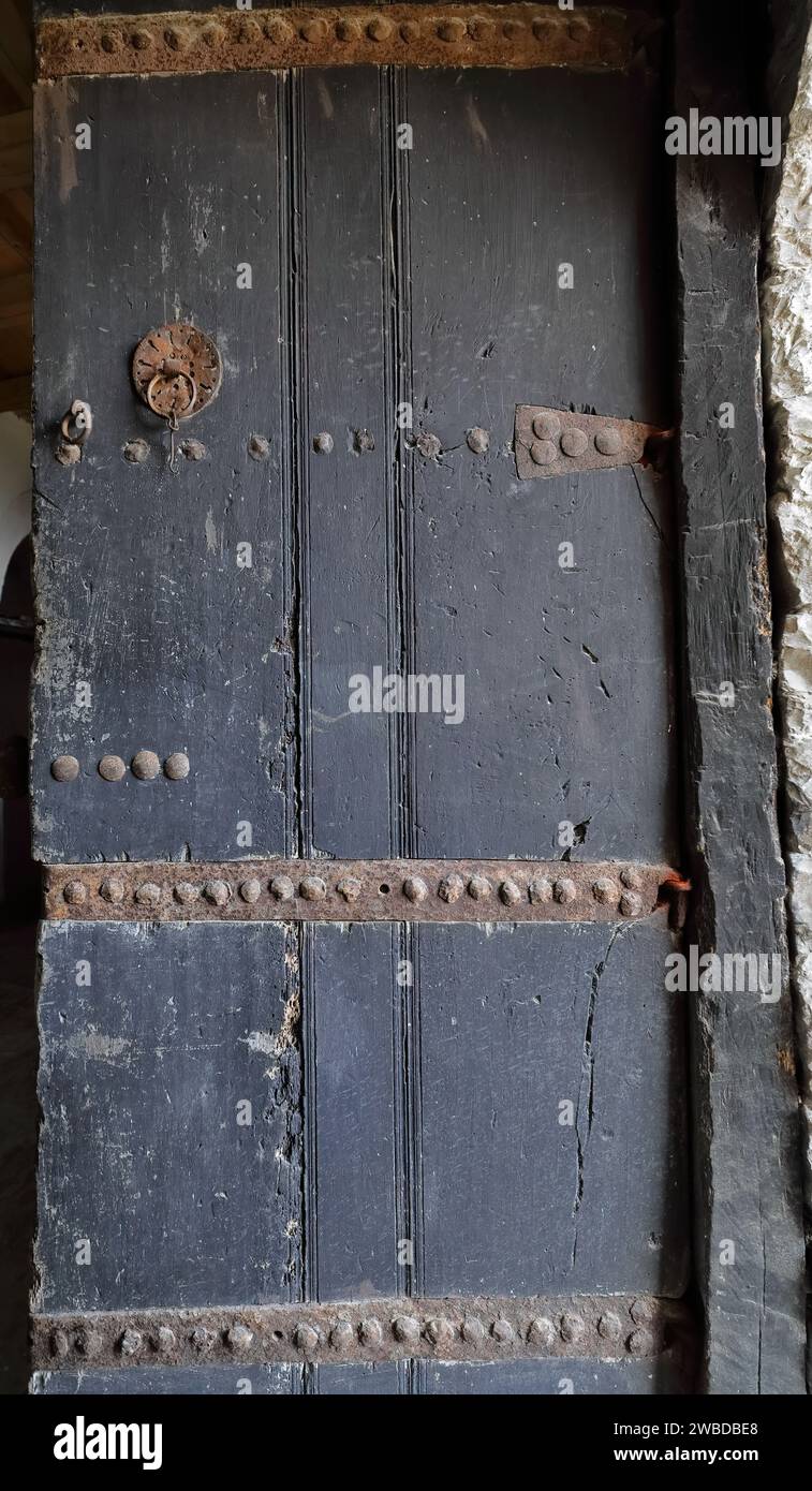 218 Iron-reinforced old wooden door of an Ottoman-style house, the richest in town, in the old city upper part. Gjirokaster-Albania. Stock Photo