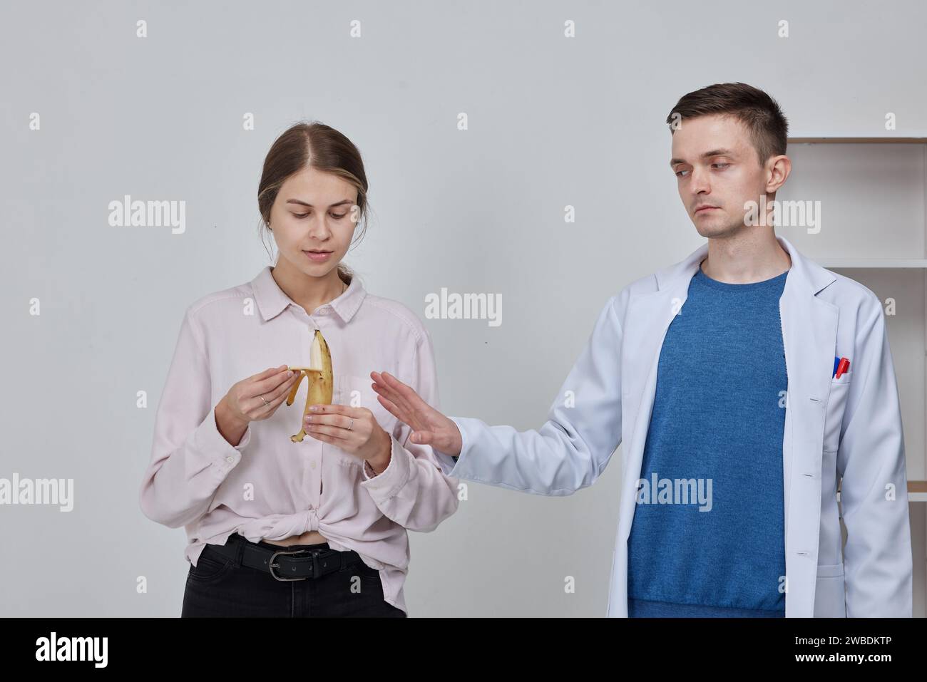 doctor with patient about prohibition and restriction of food before