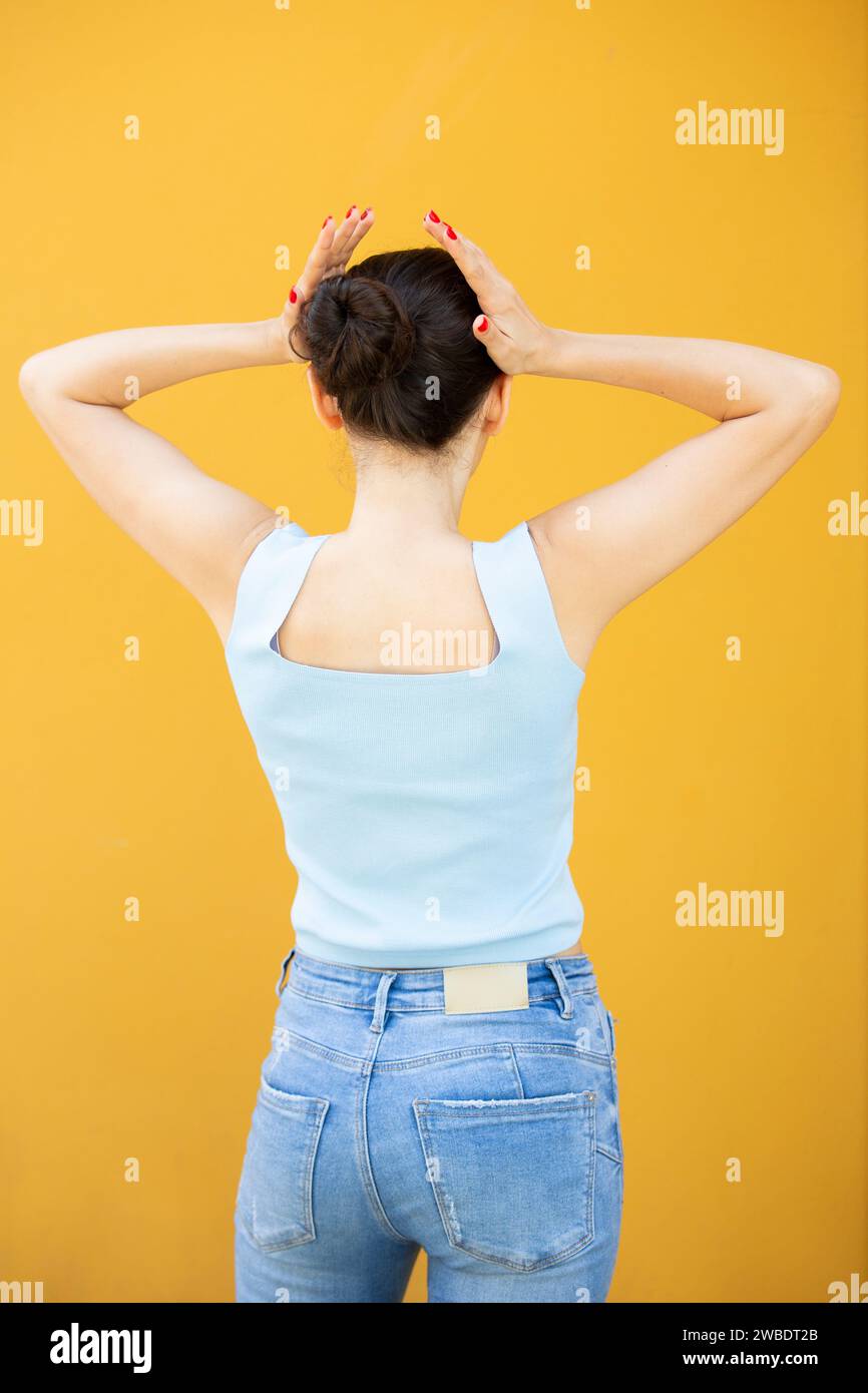 rear view woman head in hands Stock Photo - Alamy