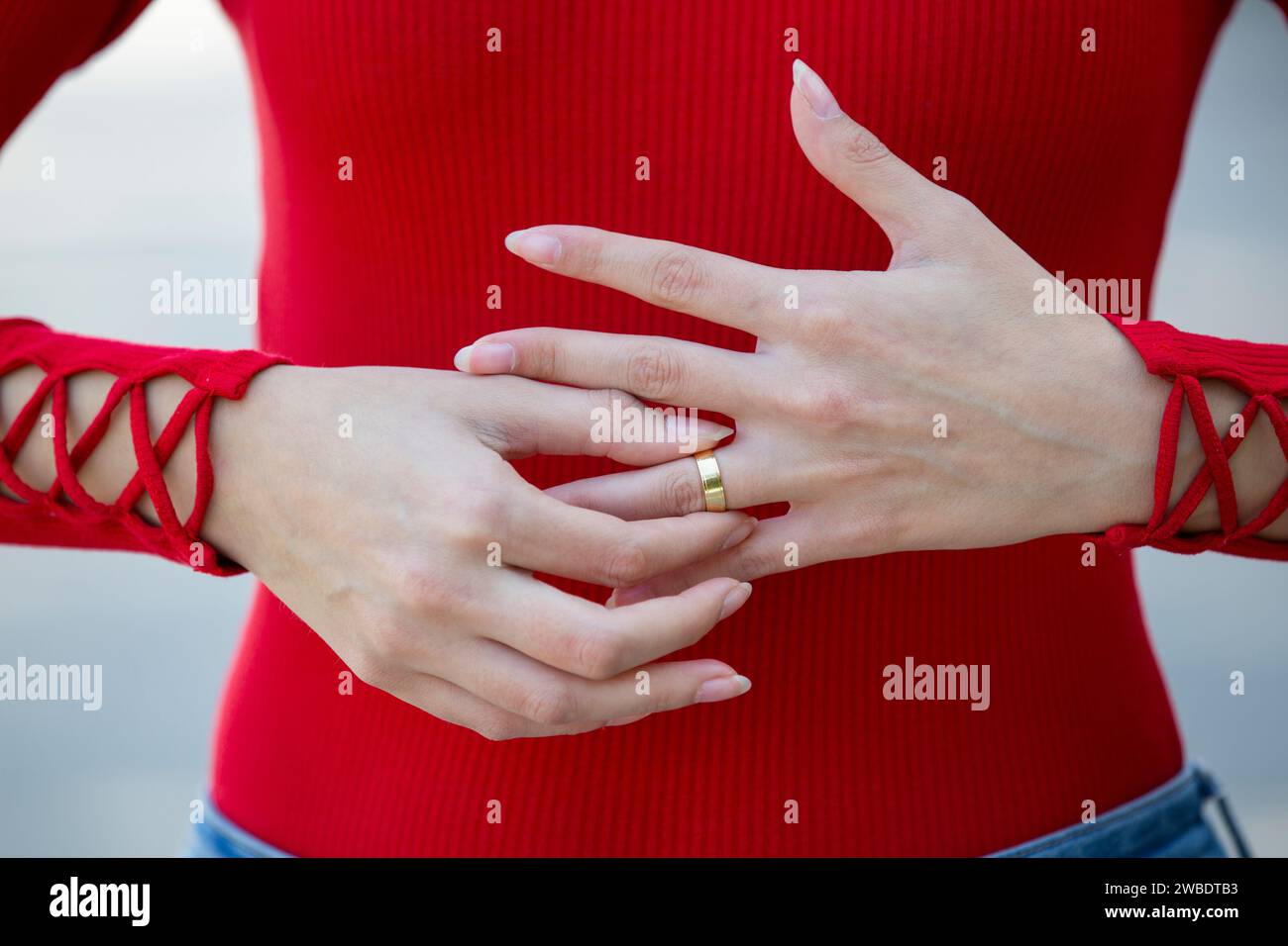 Close up of woman removing her wedding ring Stock Photo