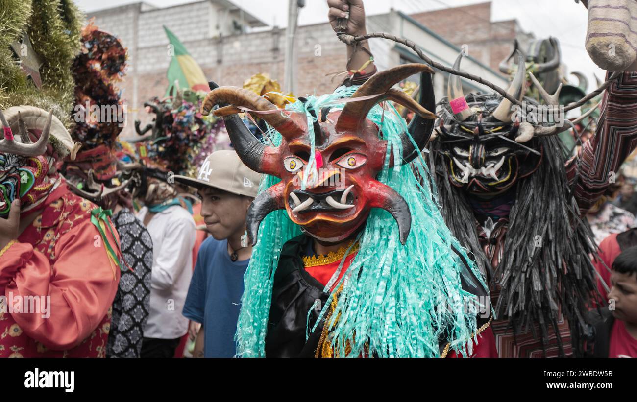 Pillaro, Tungurahua / Ecuador - January 6 2024: Crowd of people dressed as devils parading in the traditional Diablada Pillarena the city of Pillaro - Stock Photo