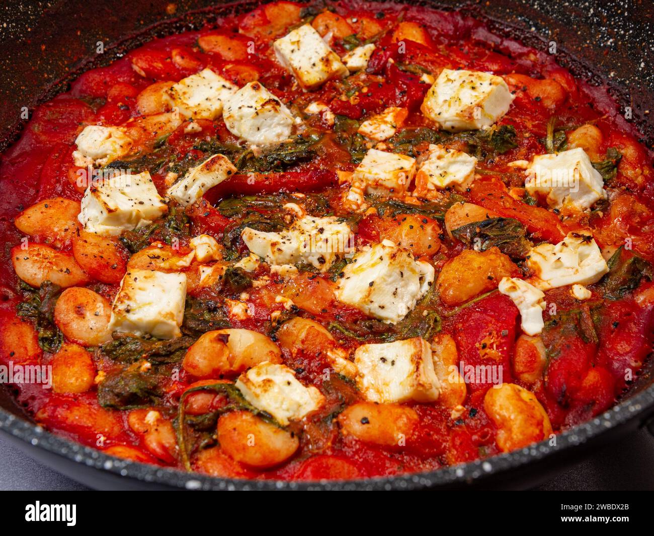 Crispy grilled feta with saucy butter beans Stock Photo Alamy