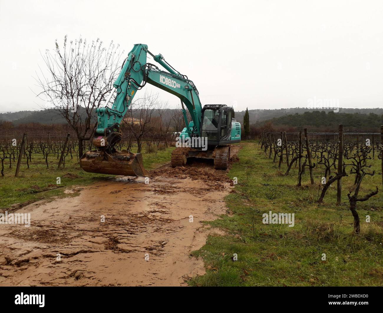 kobelco excavator at a construction site, heavy machinery for earthworks and building project kobelco Excavator at a construction site Stock Photo