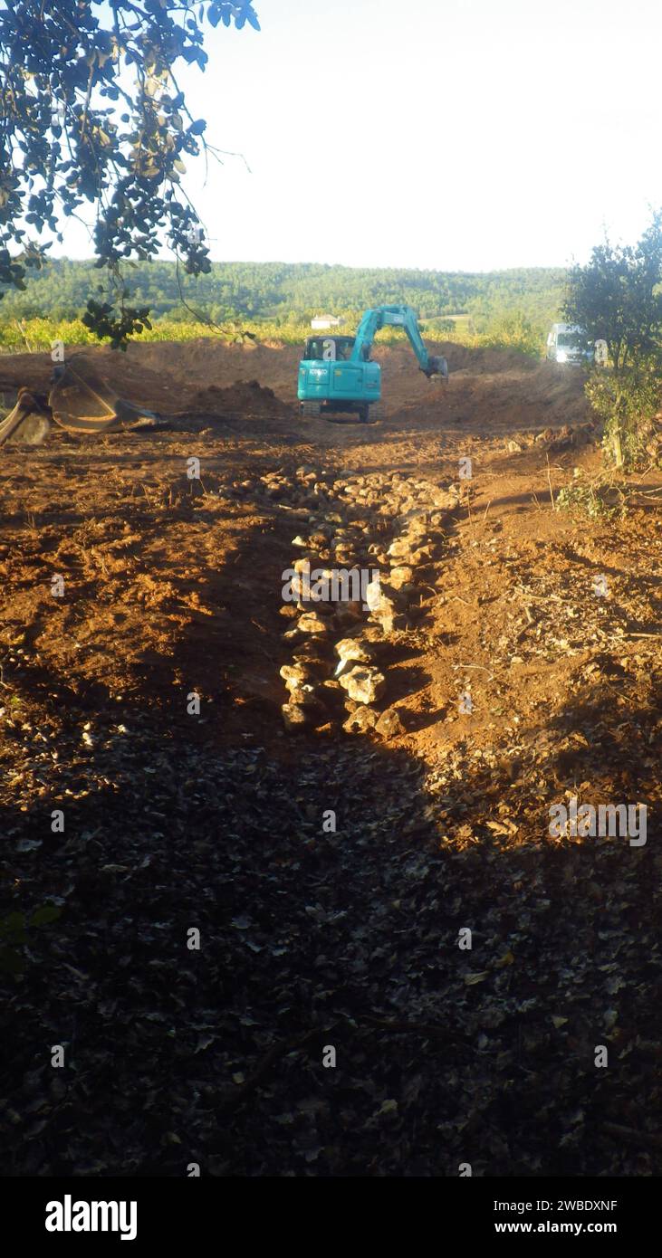 kobelco excavator at a construction site, heavy machinery for earthworks and building project kobelco Excavator at a construction site Stock Photo