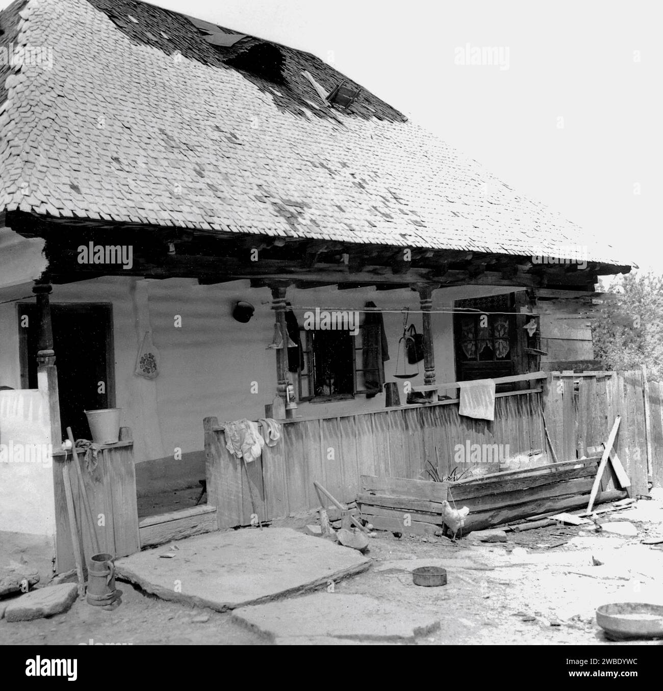 Vrancea County, Socialist Republic of Romania, approx. 1978. Exterior of a traditional rural house with wood shingle roof. Stock Photo