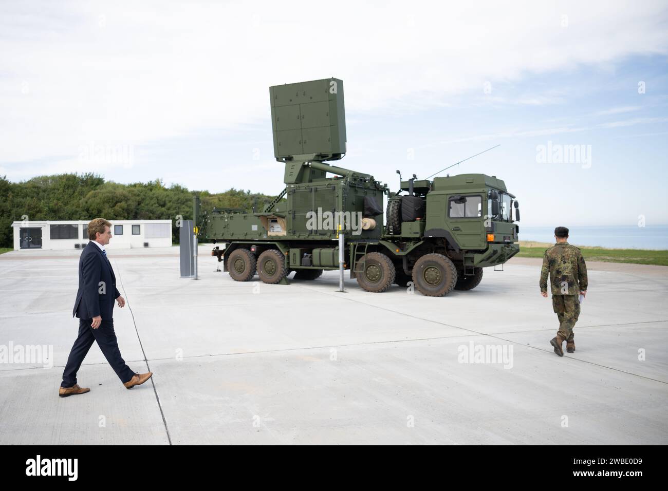 Panker, Germany. 05th Sep, 2023. Harald Buschek (l), Managing Director at Diehl Defence, walks past a launcher of the IRIS-T SLM air defense system from Diehl Defence during the presentation of the European Air Defence Academy at the Todendorf barracks. The German government has approved arms deliveries to Saudi Arabia. Government spokesman Steffen Hebestreit confirmed a report in Berlin on Wednesday by 'Der Spiegel', according to which the export of 150 Iris-T air-to-air missiles is involved. Credit: Sebastian Christoph Gollnow/dpa/Alamy Live News Stock Photo