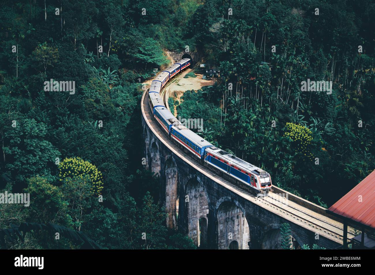 Train in Sri Lanka on Nine Arch Bridge. Railway to Ella from Kandy. Country tourism. Green forest and jungle. Rail travel in Ceylon. Stock Photo
