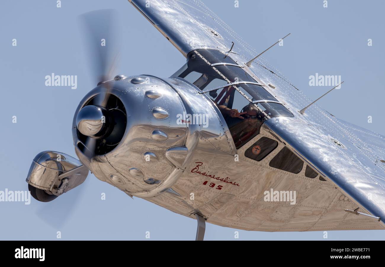 A 1950 Cessna 195 A Businessliner flying in a blue sky in Sivrihisar Air Show 2023 Stock Photo