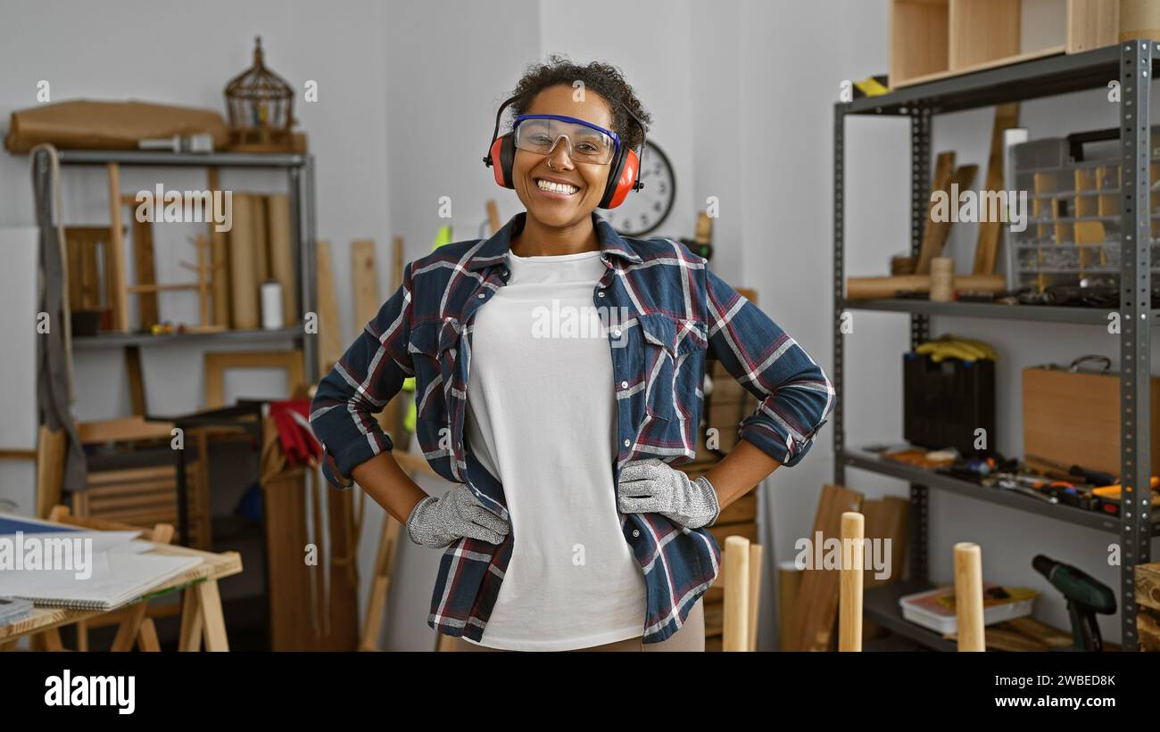Confident woman with protective eyewear stands in a woodworking