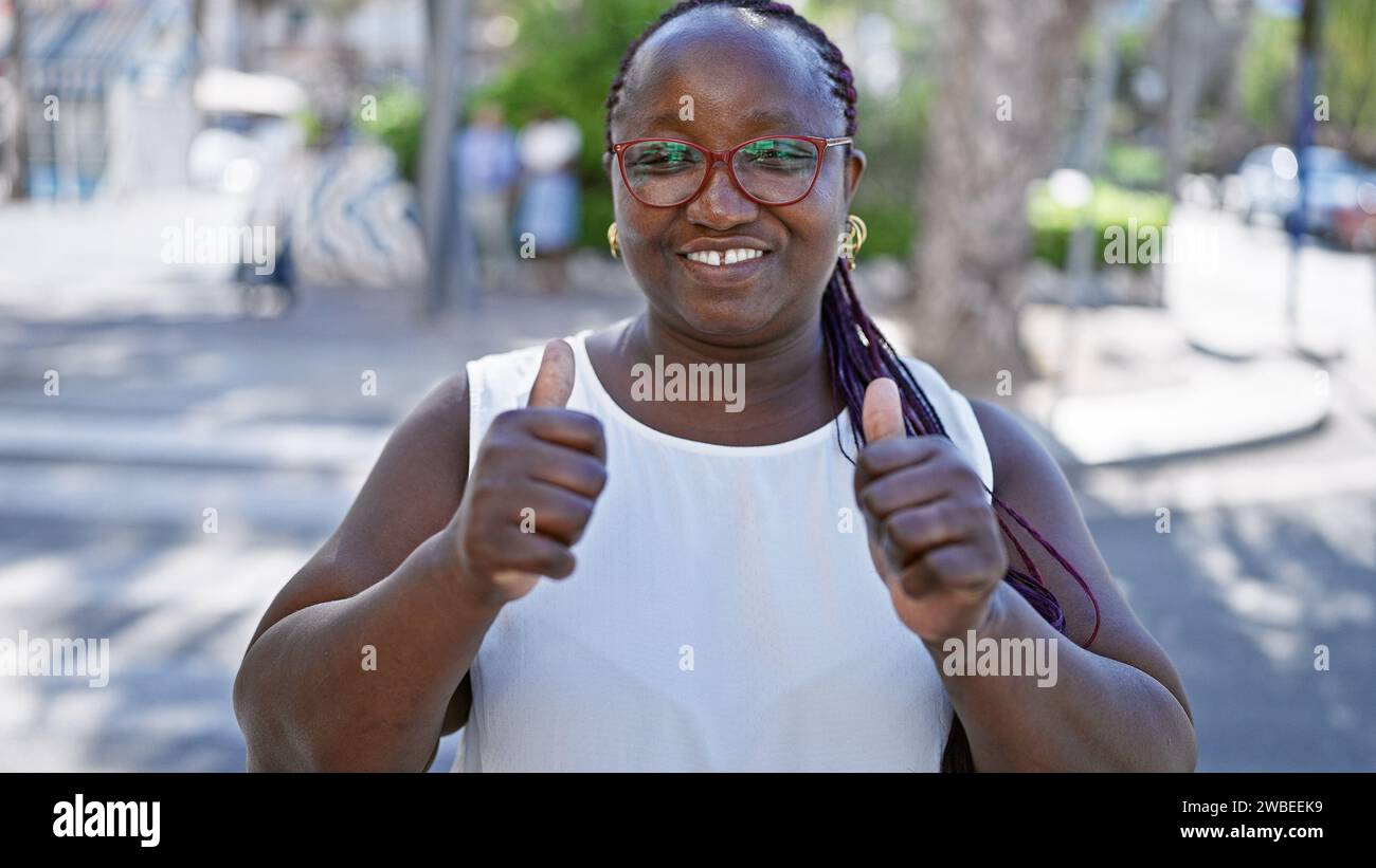 Joyful, confident african american woman flashing a fun, approving ...