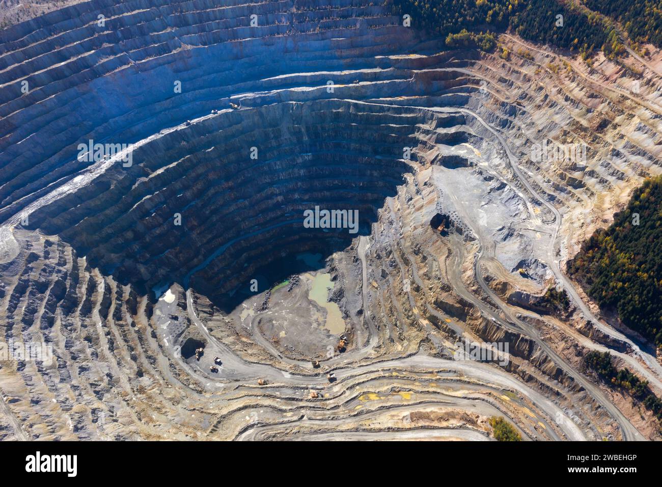 Aerial drone view of Europe second largest open pit copper mine, Rosia Poieni, Romania Stock Photo