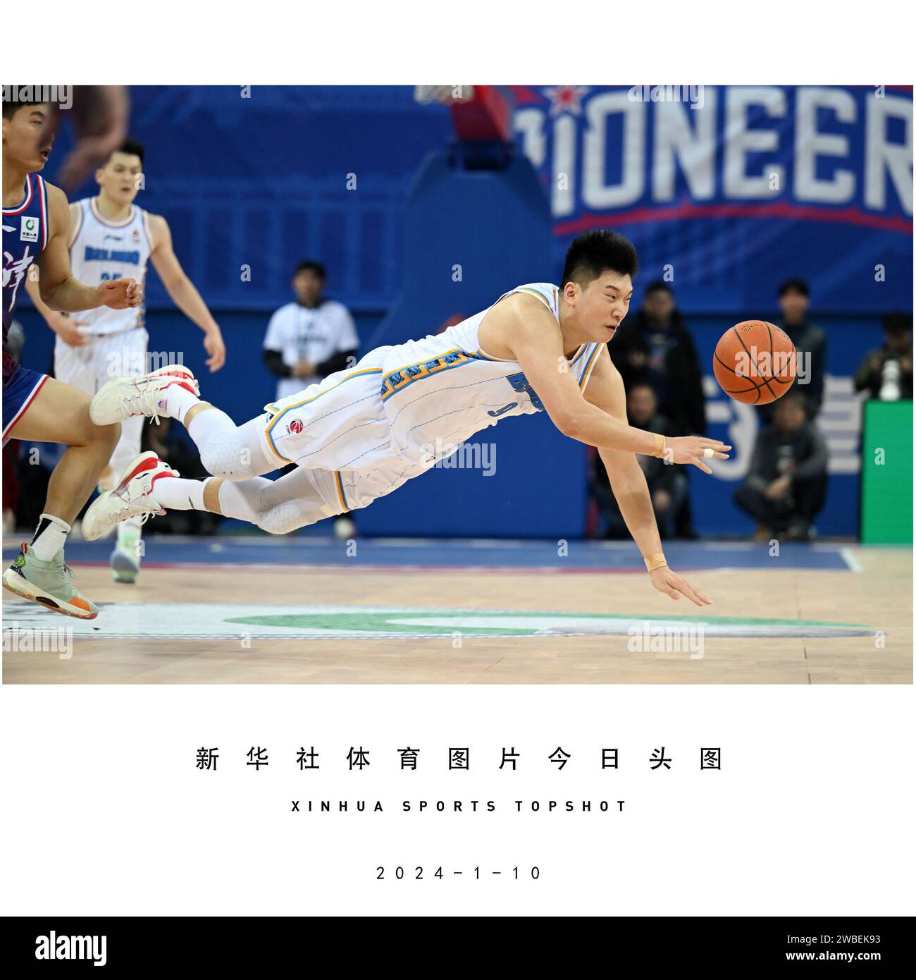 Beijing, China. 10th Jan, 2024. Lei Meng (C) of Beijing Ducks falls ...
