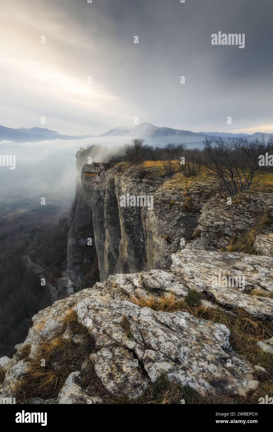 Enjoying a beautiful sunset from the plateau of the Stone of Bismantova on a foggy day Stock Photo