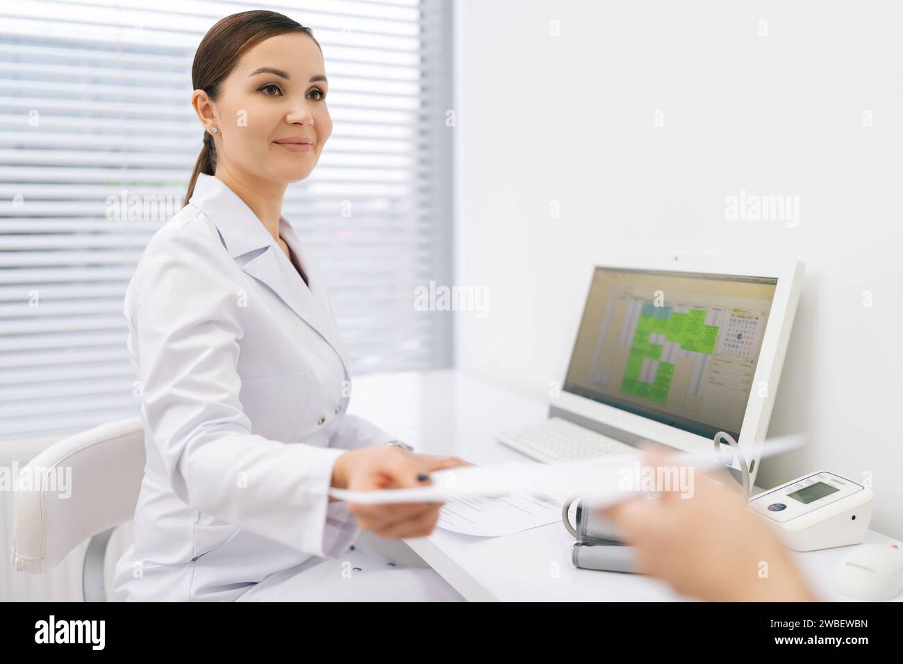 Friendly doctor giving out hi-res stock photography and images - Alamy