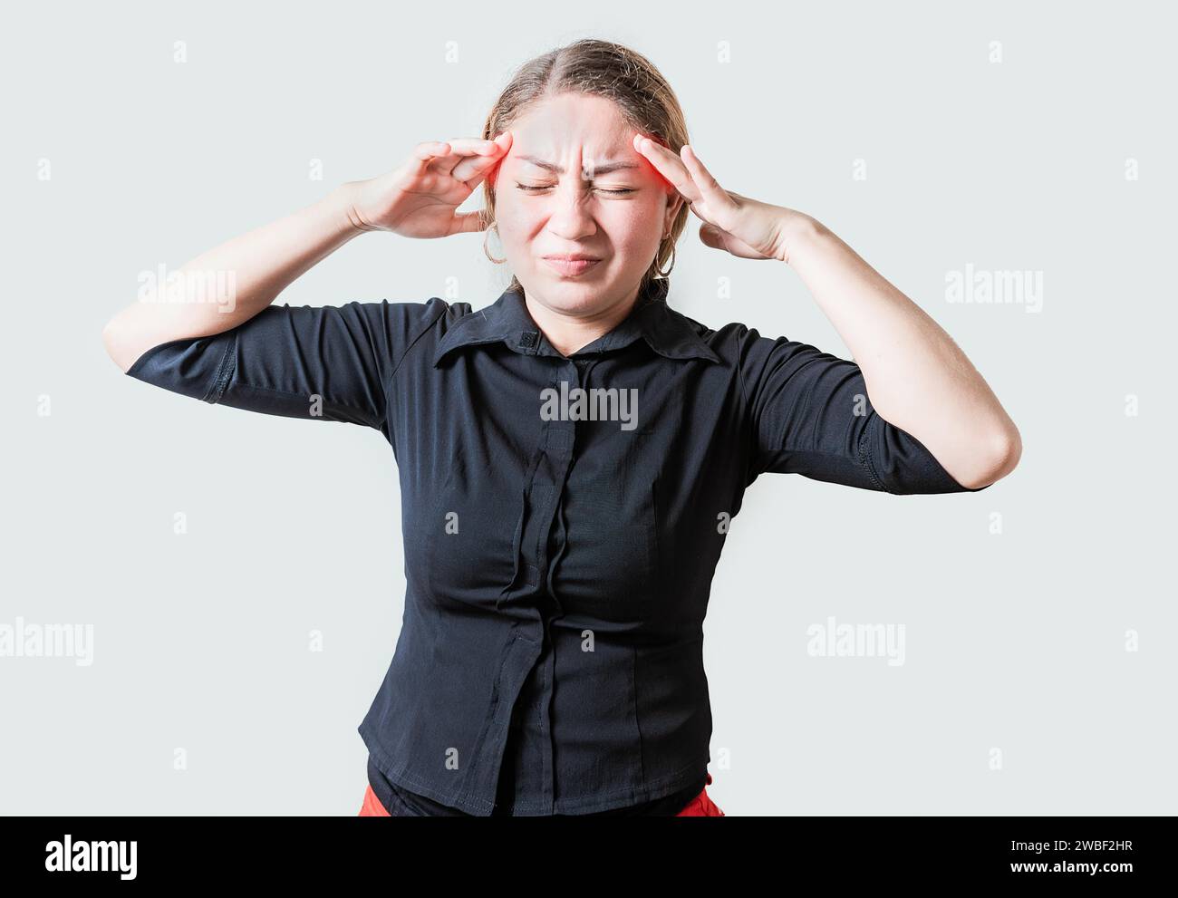 Young woman with headache isolated. Portrait of girl suffering from migraine on isolated background. Headache concept Stock Photo