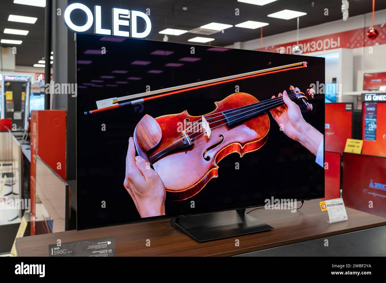 New Samsung OLED TV display inside electronics store. Minsk, Belarus
