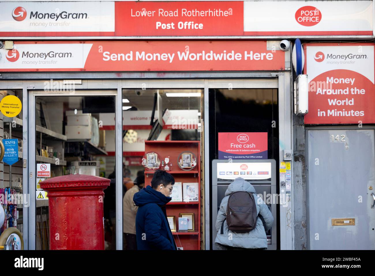 View of a facade of a shop with a MoneyGram post office sign in London