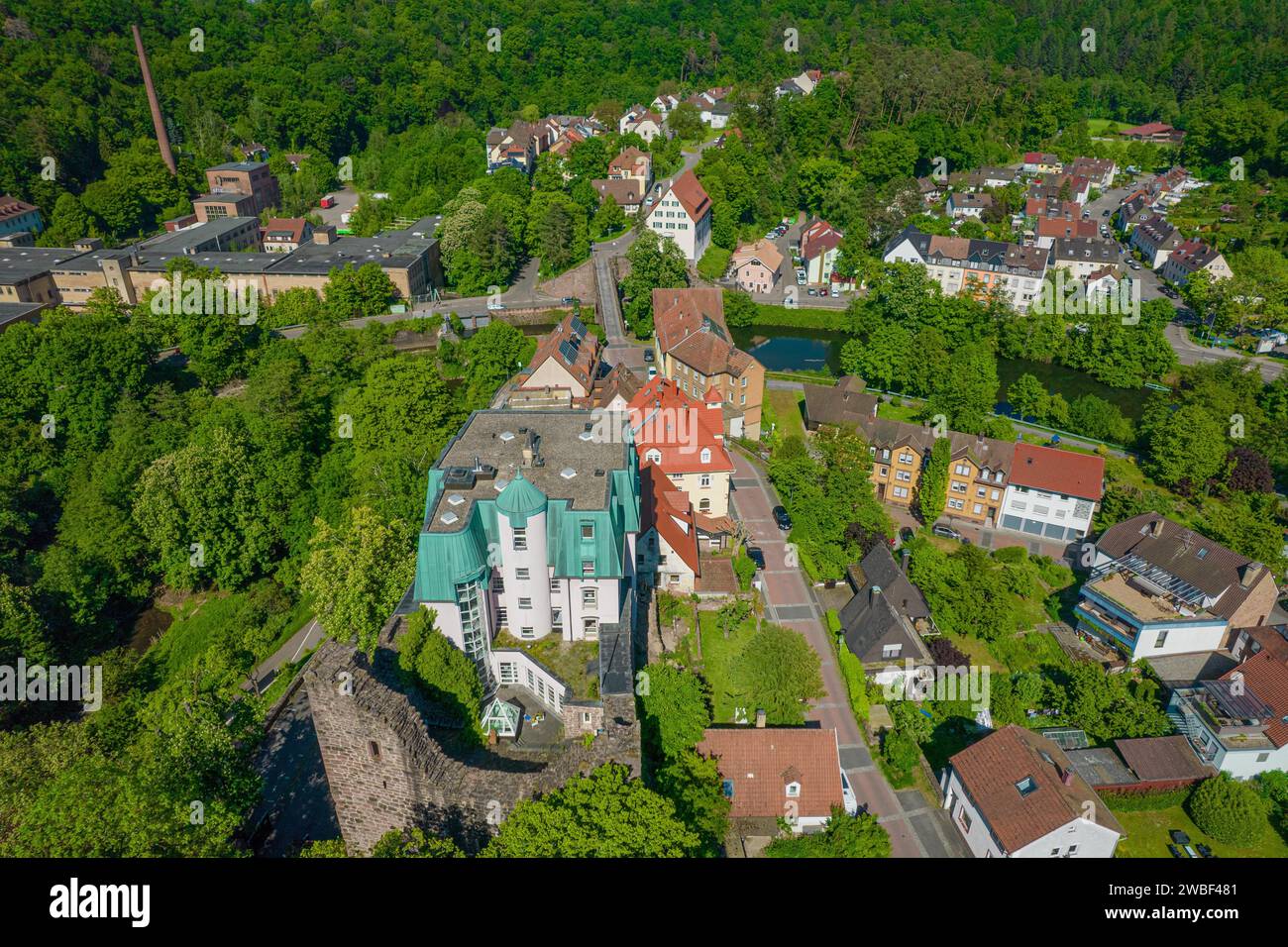 Drone view of a small town with green roofs and dense woodland, Pforzheim, Rabeneck Youth Hostel, Germany Stock Photo