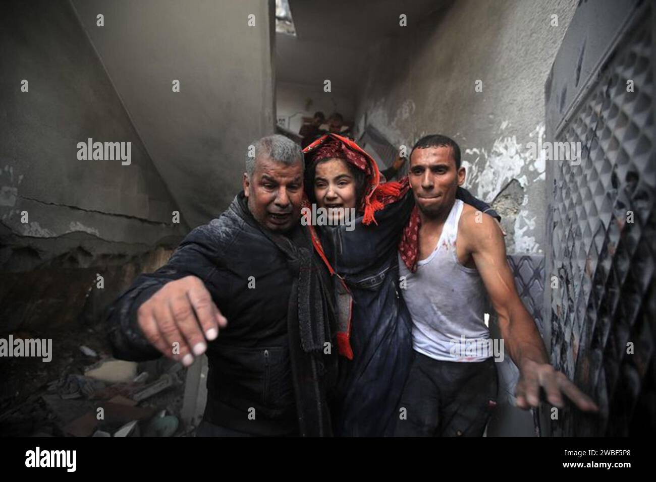 A Palestinian woman, a survivor of the rubble, cries as a result of the ...