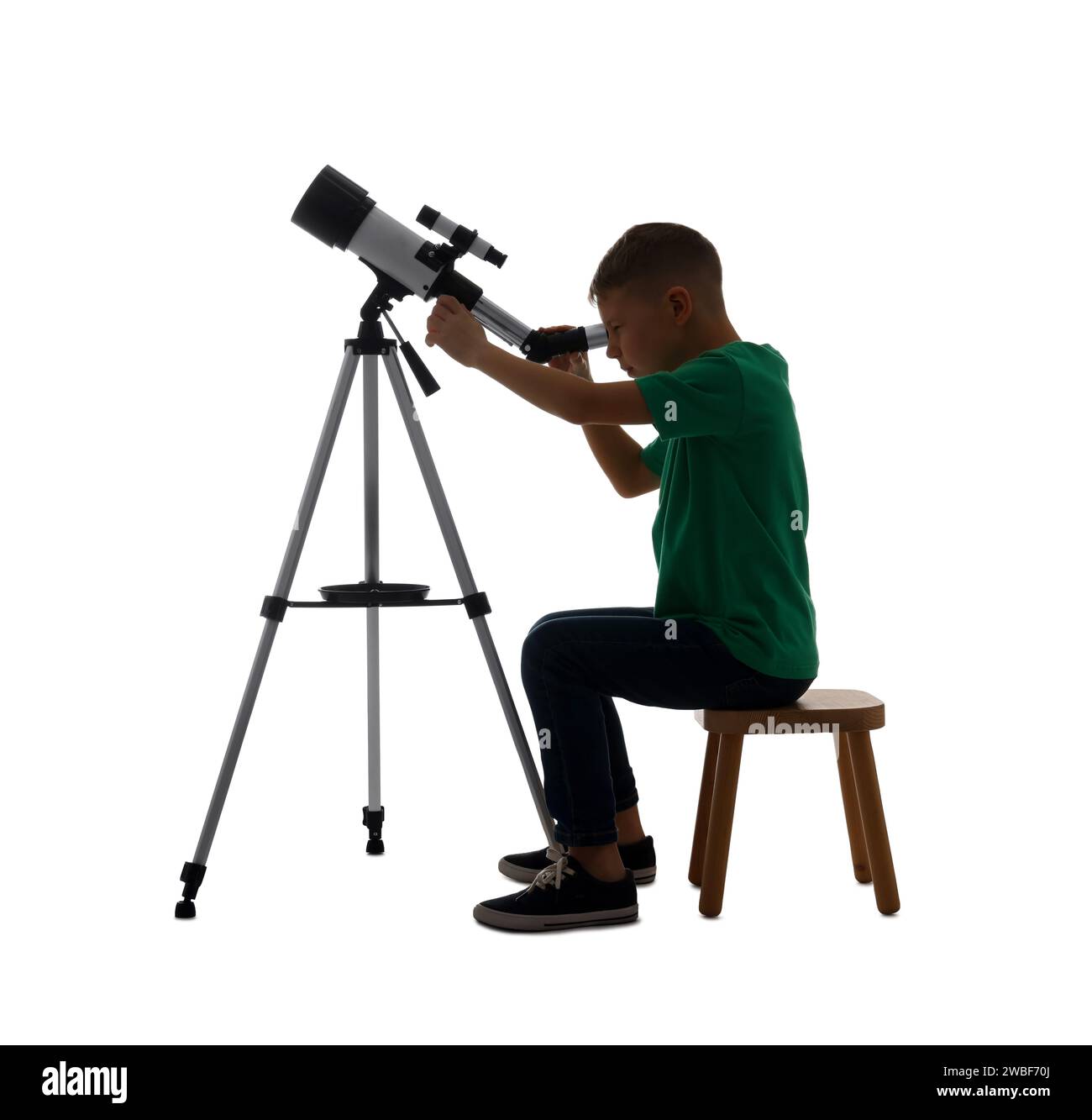 Little boy looking at stars through telescope on white background Stock