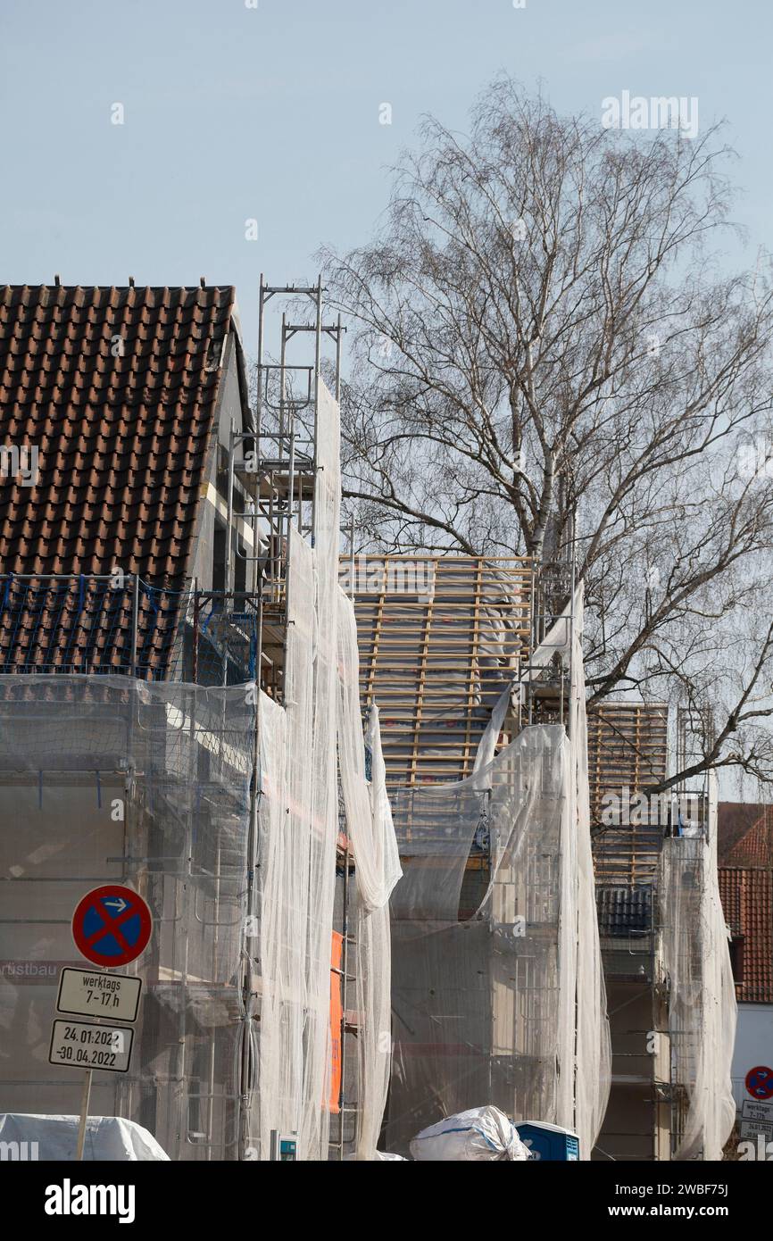 Scaffolded residential building, construction site, refurbishment