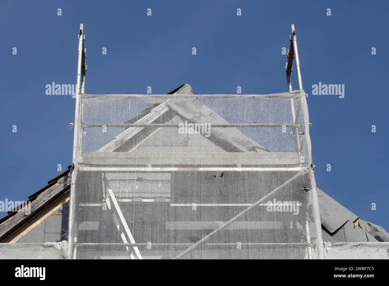 Scaffolded residential building, construction site, refurbishment
