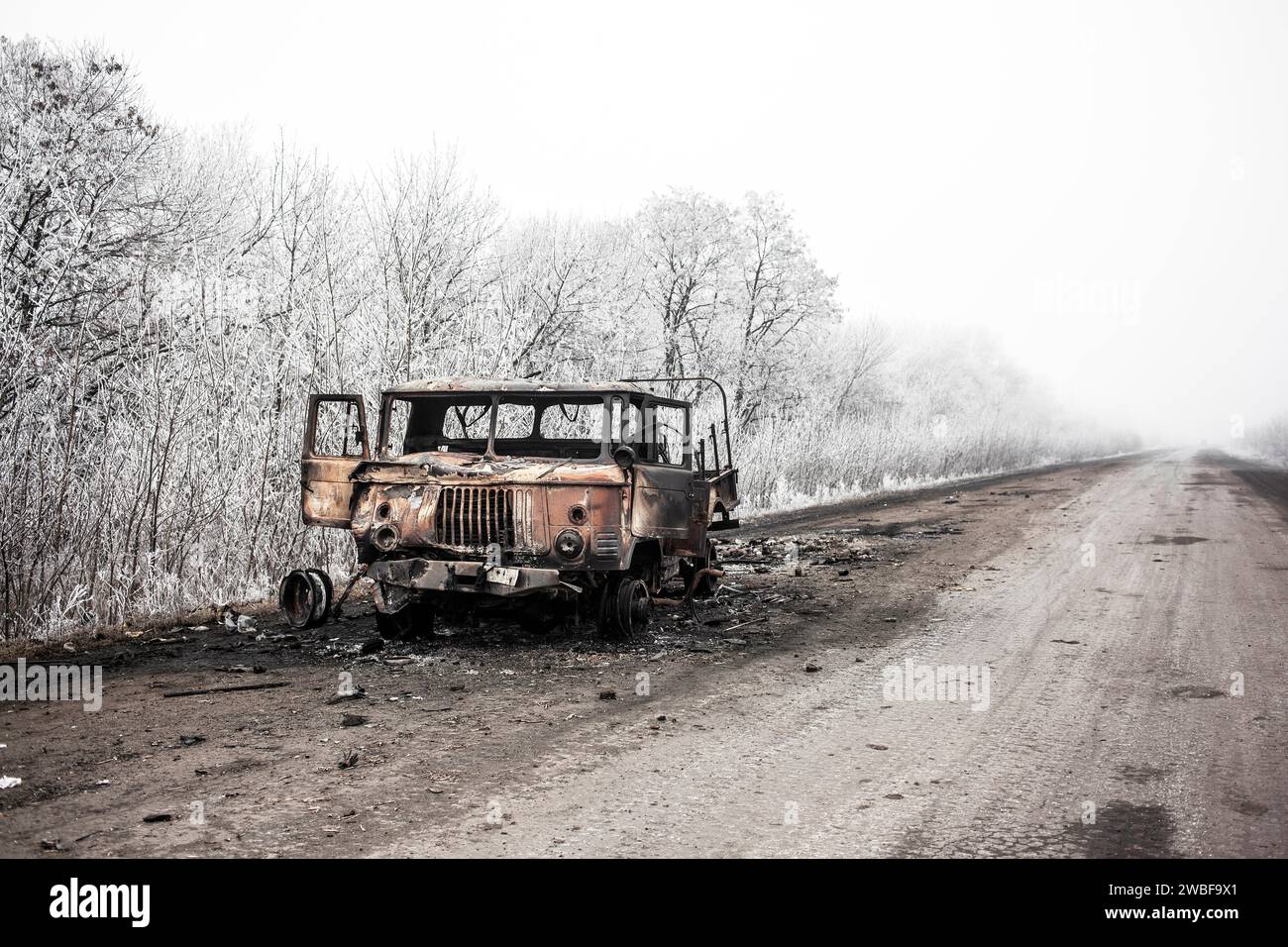 Destroyed lorry, wintry landscape, front near Debaltseve, Donbas, Ukraine Stock Photo