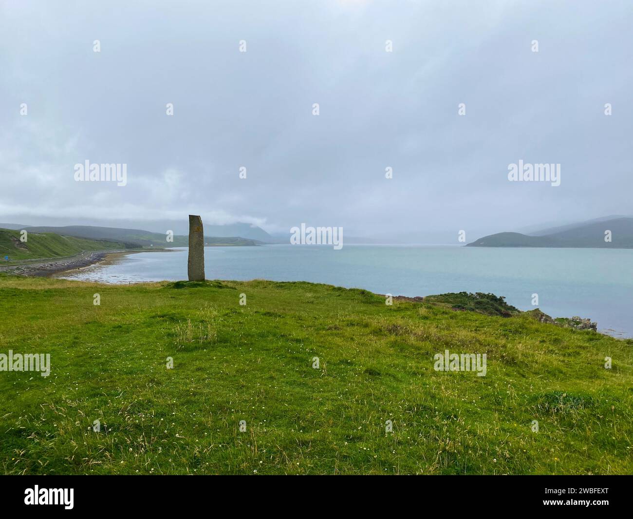 Standing stone with Celtic symbol by River Dionard in Kyle of Durness Stock Photo