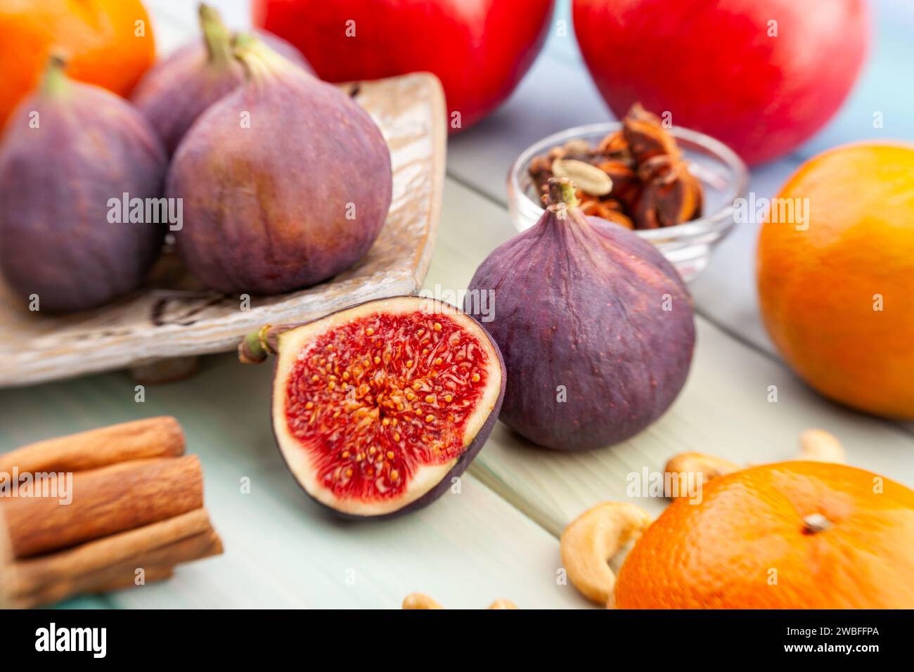 sliced figs on wood background Stock Photo
