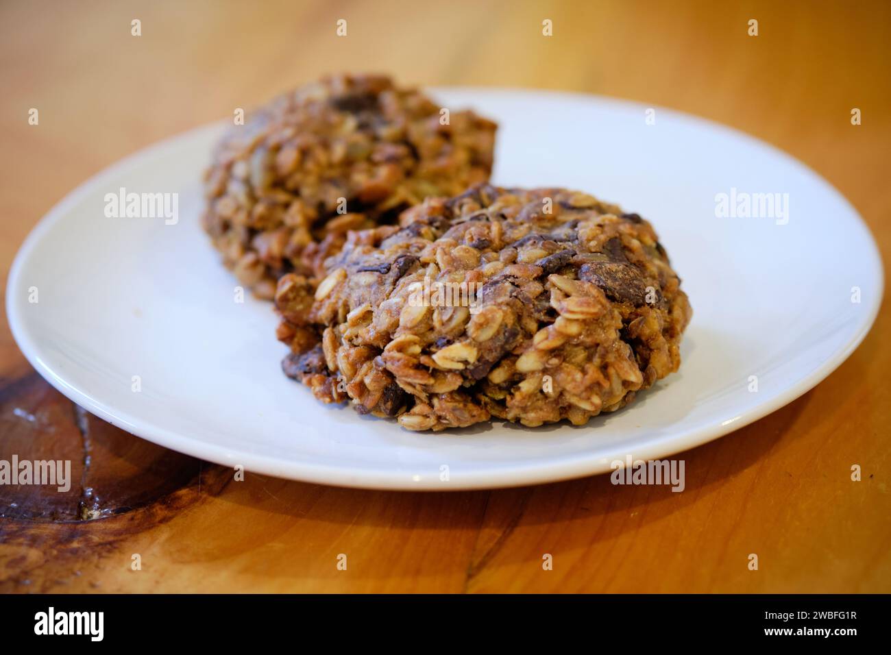 Two cosmic cookies on a white plate Stock Photo