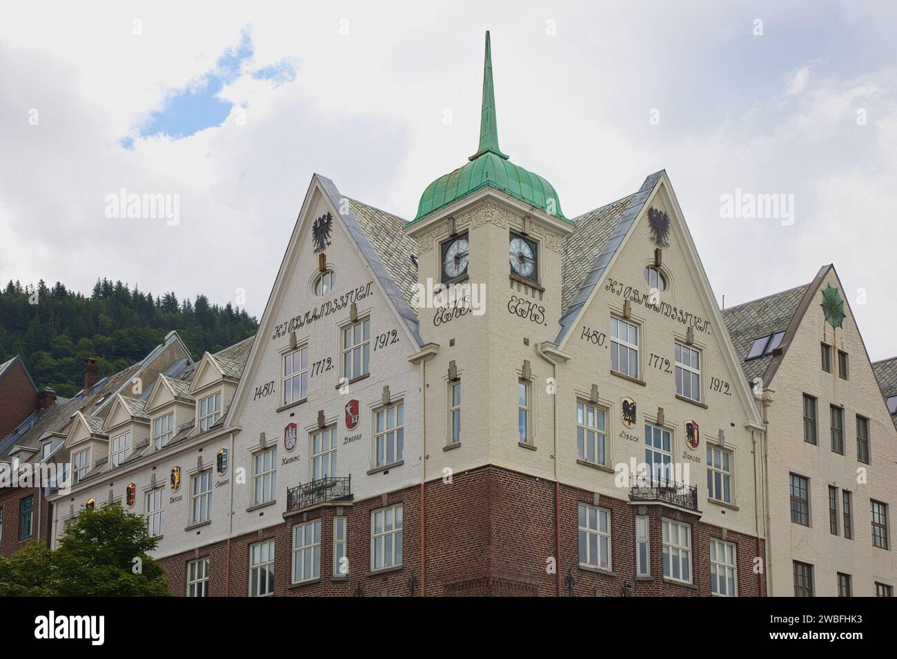 Norway, Vestland, Bergen - July 22, 2023: House in Bryggen with Hanseatic coat of arms. Stock Photo