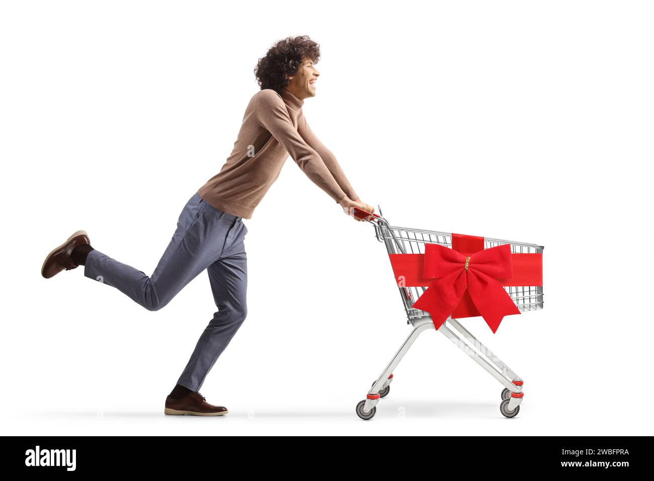 Full length profile shot of a young man running with an empty shopping