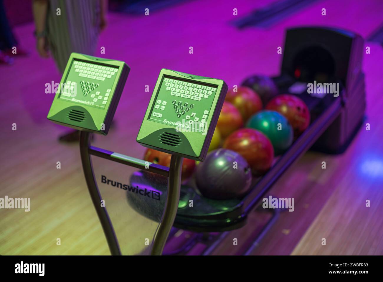 Colorful view of the ball rack and player name introductions in a