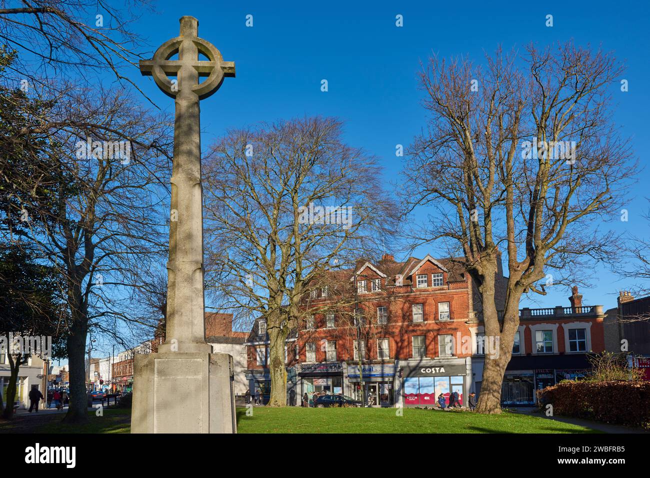 Chipping Barnet, Greater London UK, looking towards the High Street with the war memorial in the foreground in Barnet Church Garden Stock Photo