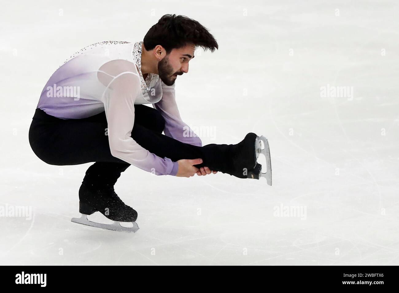 Kevin Aymoz of France performs in the men's short program during the