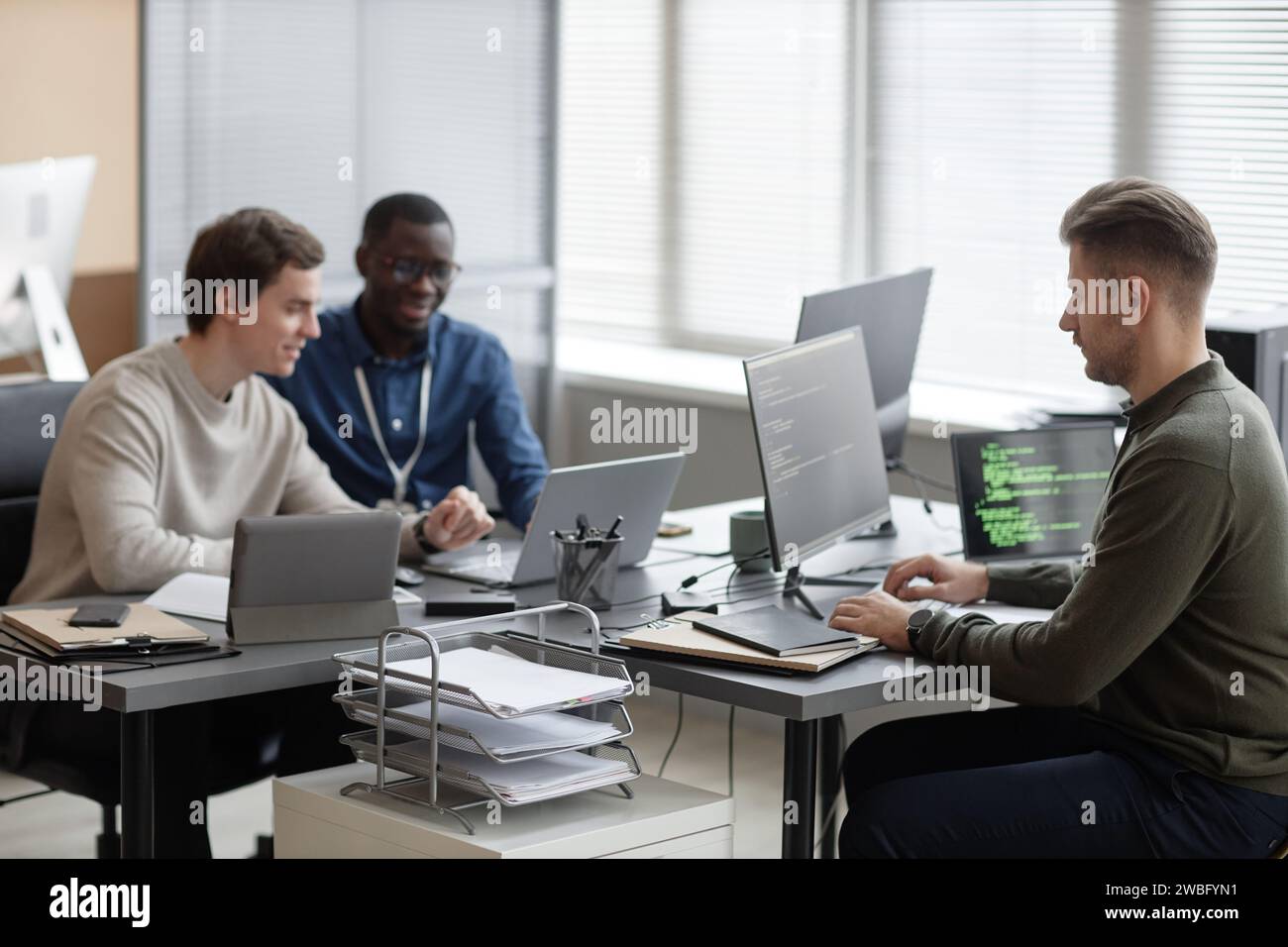 Programmers Working in Office of Cybersecurity Department Stock Photo