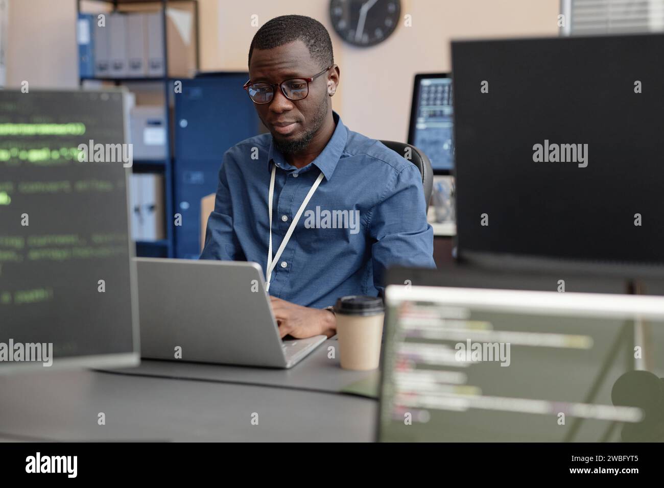 Software Developer Using Laptop in IT Company Office Stock Photo