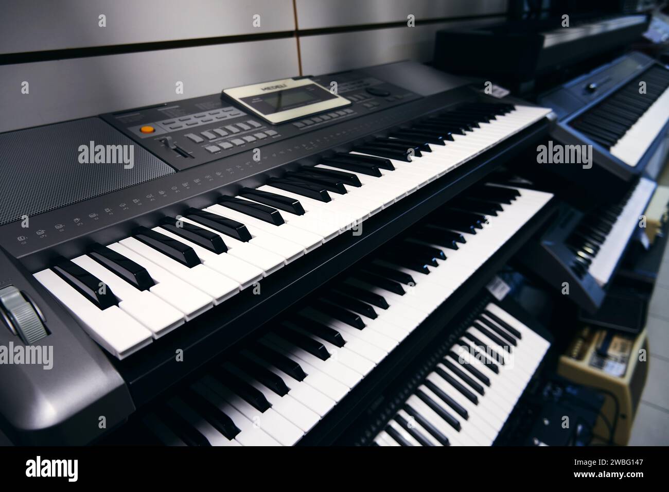 Ryazan, Russia - January 9, 2024: Piano synthesizers in a music store Stock Photo